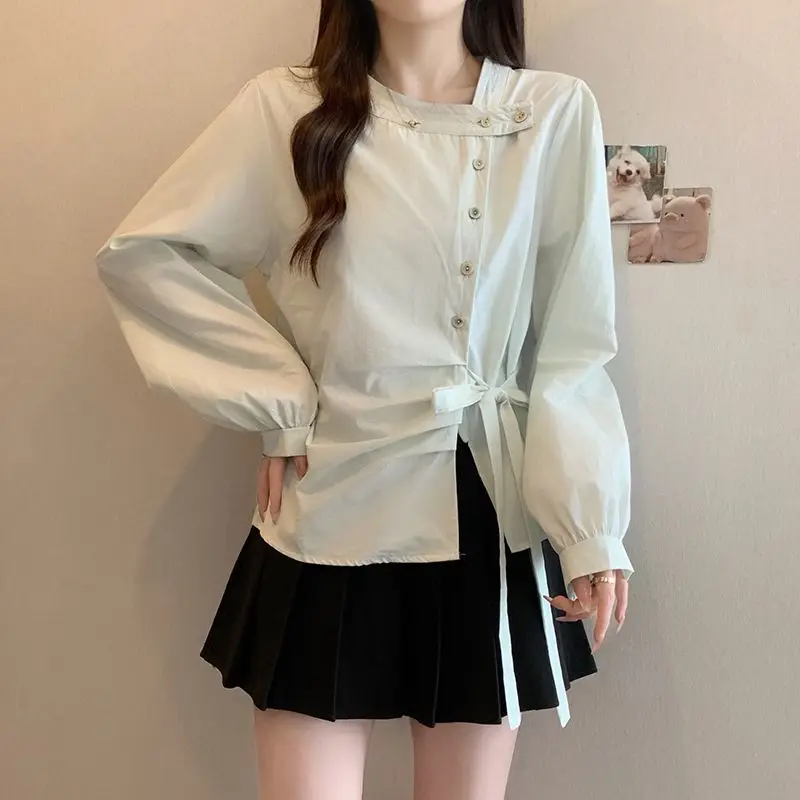 Femme Primavera Estate Tendenza moda coreana Bottoni Tinta unita O-Collo Camicie da donna Pullover a maniche lunghe con coulisse alla moda