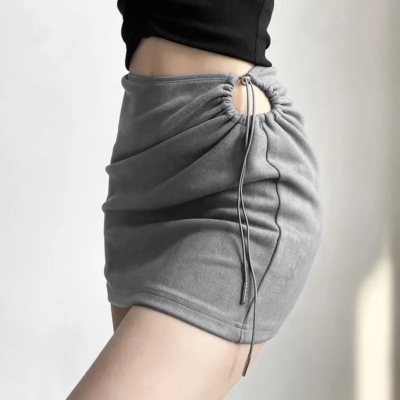 مثير التوابل فتاة تنورة من جانب واحد أضعاف سليم سليم تنورة مجوفة 2025 الربيع والصيف الفتيات نمط ملابس نسائية