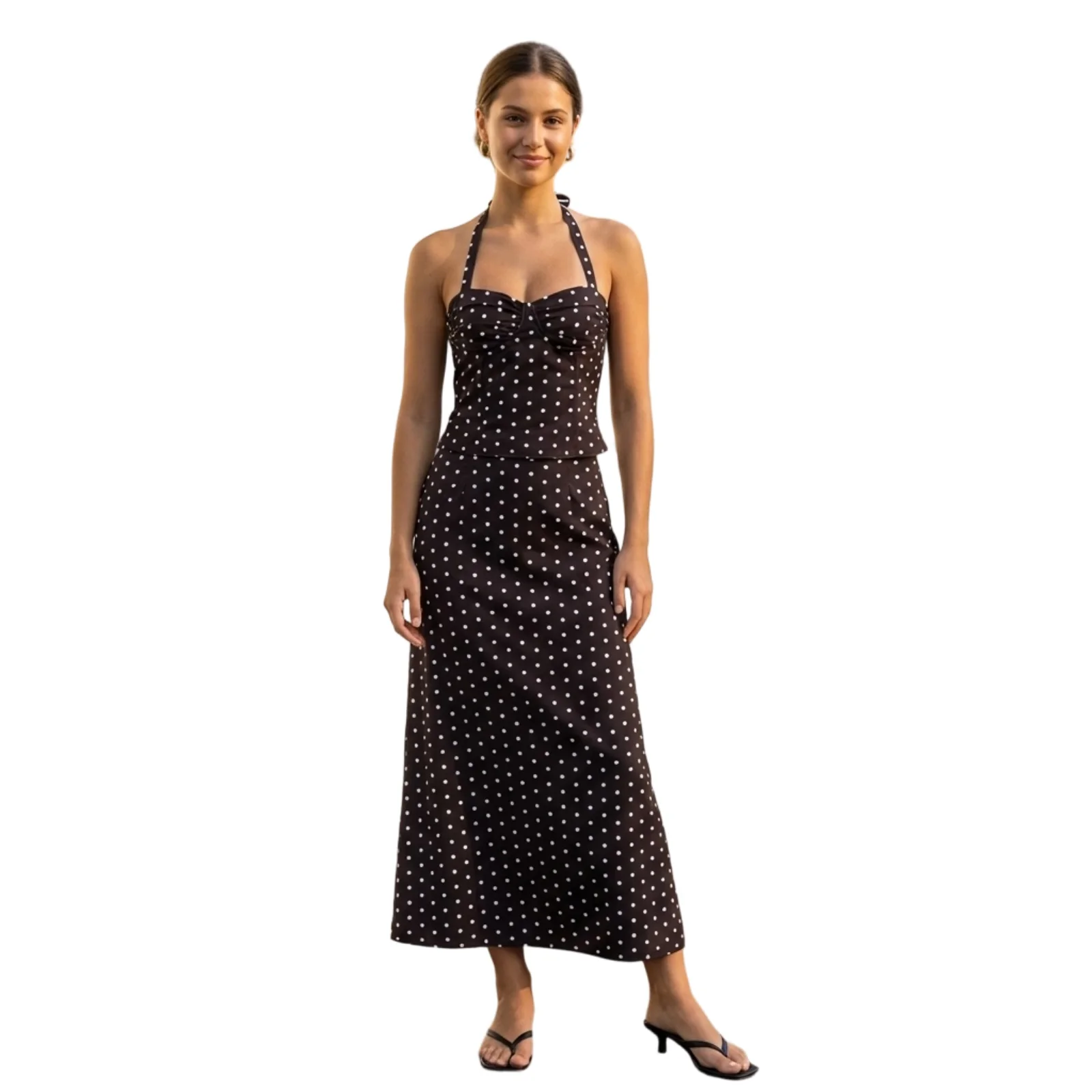 

Женский комплект из двух предметов: топ-халтер с принтом в горошек и юбка-«рыбий хвост» с низкой посадкой