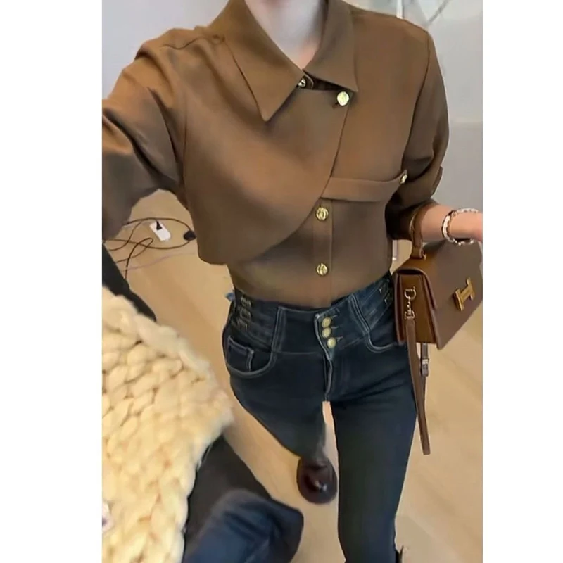 Elegant Lapel Button Solid Color Asymmetrical Shirts Women\'s Clothing 2023 Autumn Winter Loose Korean Tops Office Lady Blouses