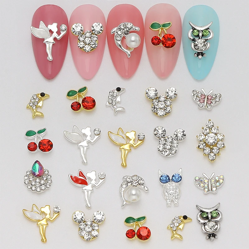 

100 pieces of nail art decorations made of gold and silver alloy, featuring cute cherry dolphins and owls. DIY nail charms.
