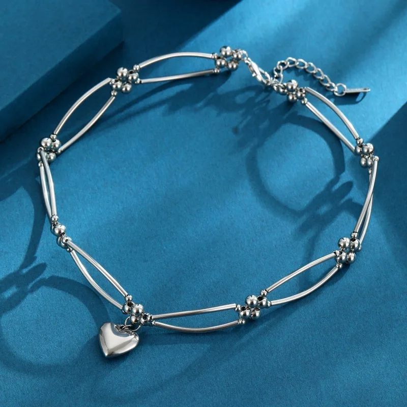 

A high-end collarbone necklace, a multi-functional metal heart-shaped necklace, brings a cool summer style to women