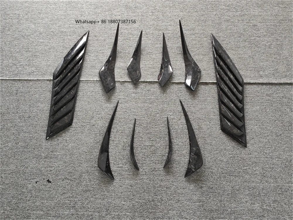 

Комплект обвеса EB Style из карбона с кованым узором: передний спойлер, задняя накладка на бампер, вентиляционные отверстия на крыльях и боковые пороги для BMW I8