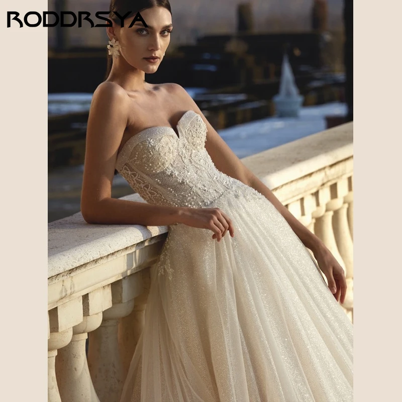 RODDRSYA Tule Cintilante Vestidos De Casamento Sem Alças Princesa Apliques Festa De Noiva Romântico Pérola Sem Encosto Zi Tule Cintilante Vestidos De Casamento Sem Alças Princesa Apliques Festa De Noivapper Custom Made