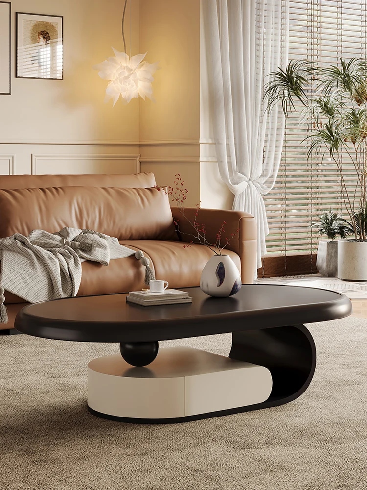 

Cream style coffee table, living room, modern and minimalist small unit, oval shaped with storage, black and white baked paint