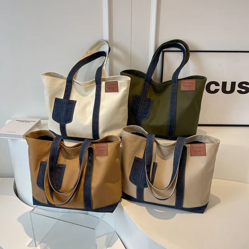 Wear-resistant and durable spliced color-blocking women's handbag, large-capacity tote bag, zipper commuter single-shoulder bag