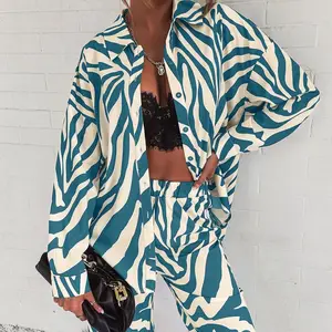 مجموعة السراويل المطبوعة بأكمام طويلة من القماش الكامل العصري 2022 قميص خارج الكتف عبر الحدود الإصدار الساخن أفضل 12 مجموعة اجتماعية من السراويل والبلوزات للمبيعات - رقم 2