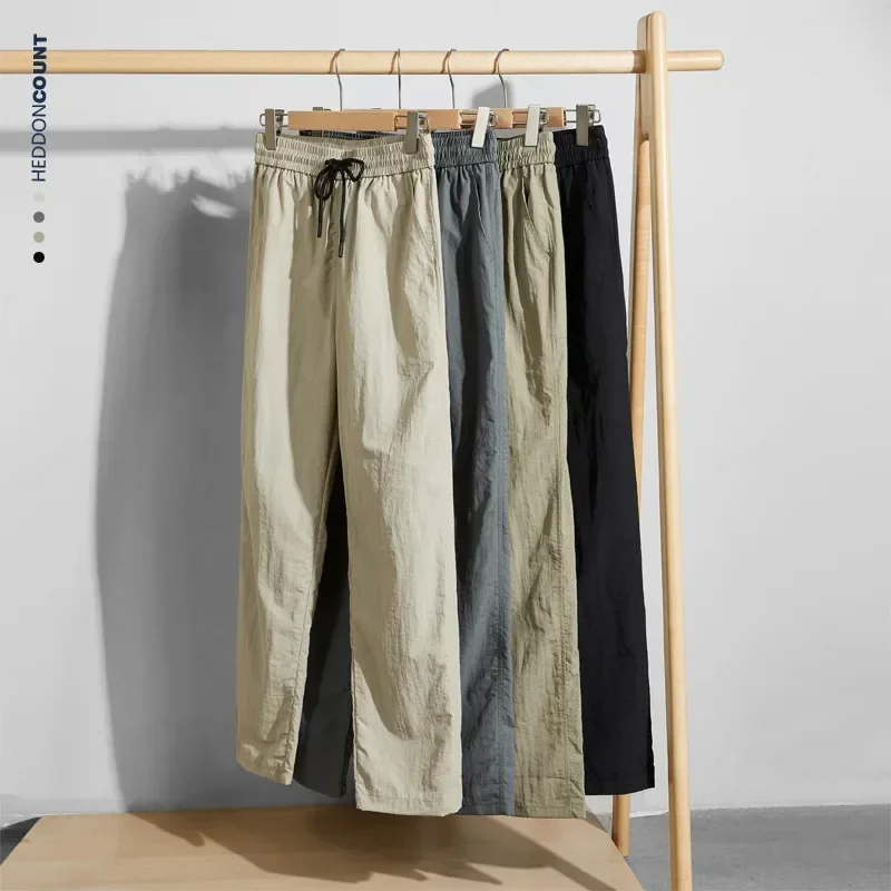 

Four Seasons New Fashion Men's Casual Trendy Solid Color Loose Trousers Breathable Outdoor Sports Drawstring Pants Male Clothes
