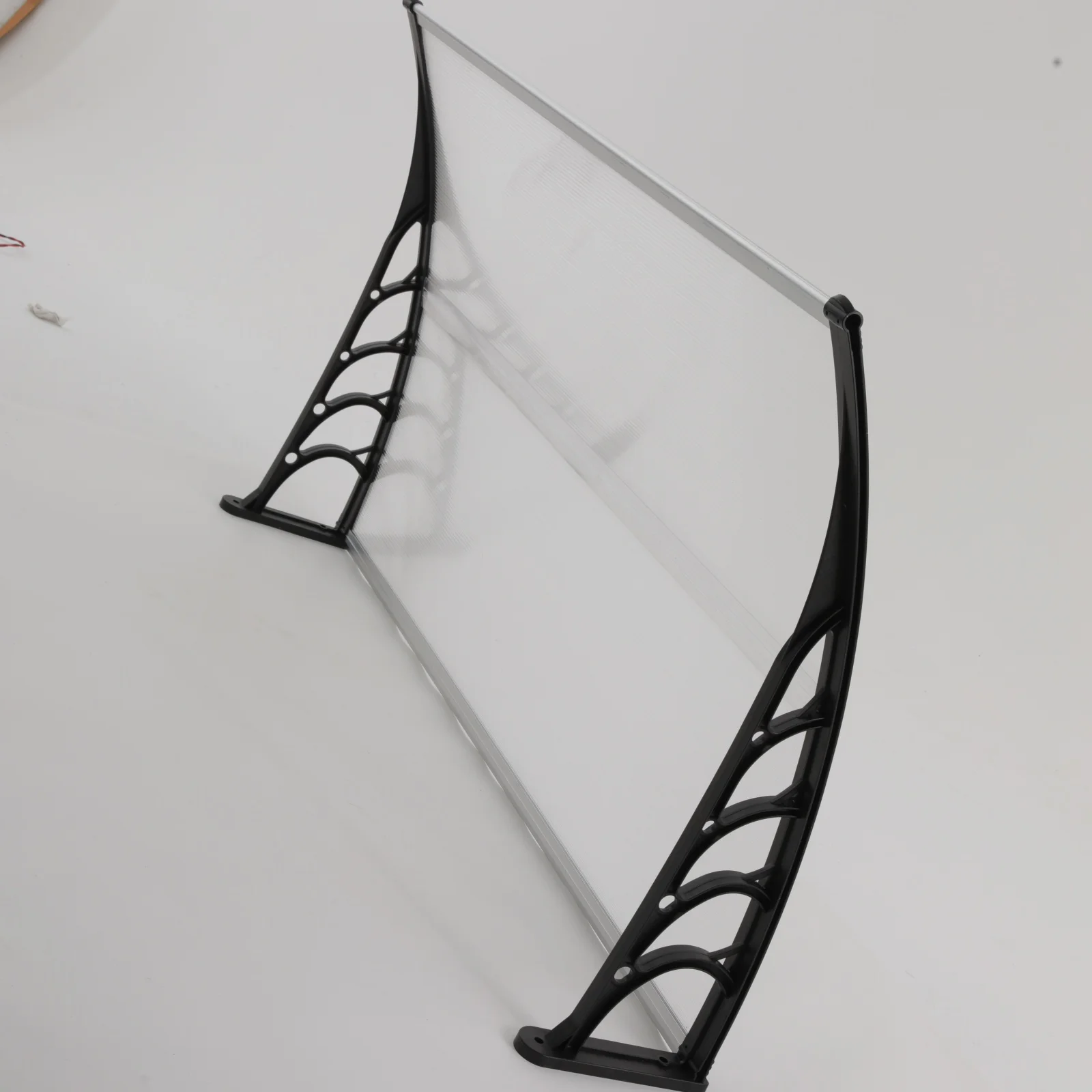 Toldo curvo para puerta principal con diseño de arco autodrenante, reduce la acumulación de nieve y residuos, orificios preperforados, fácil instalación, refugio impermeable para ventanas exteriores