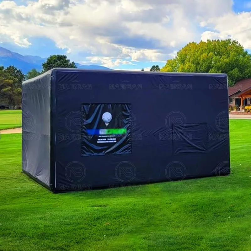 Portable inflatable golf emulator housing tent with indoor and outdoor movie screens