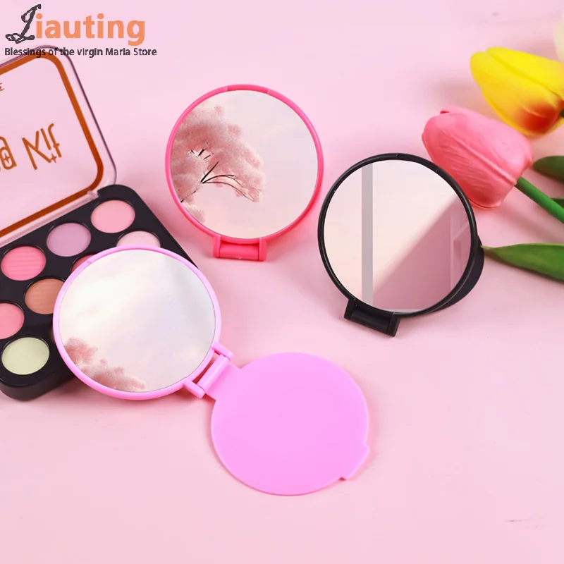 กระจกแต่งหน้า HD แนวตั้งทรงกลมแบบพกพาพับได้กระจกตั้งโต๊ะแบบใช้คู่แนวตั้งราคาไม่แพงนักเรียนจับกระจกแต่งหน้า