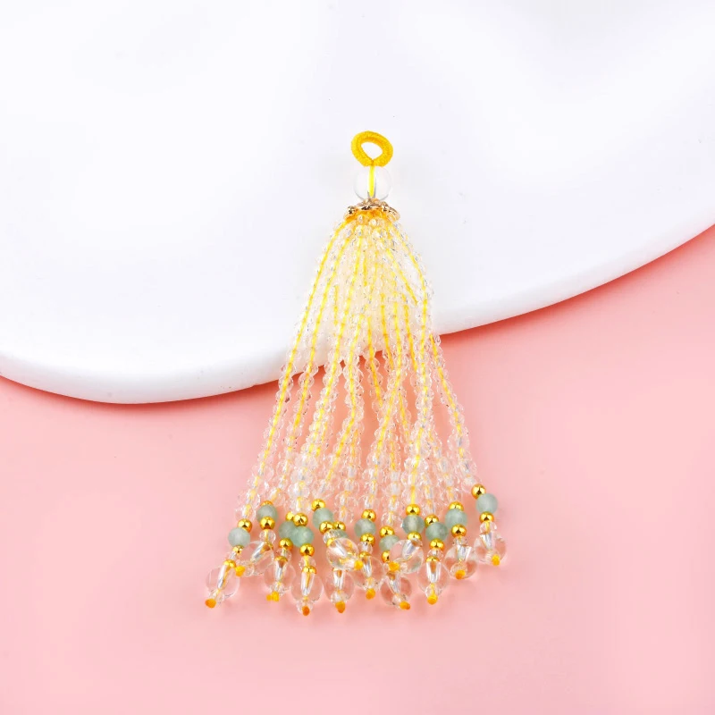 Handmade fringed mobile phone hanger with dopamine candies and gradient-colored crystal accessories as a piece of jewelry.
