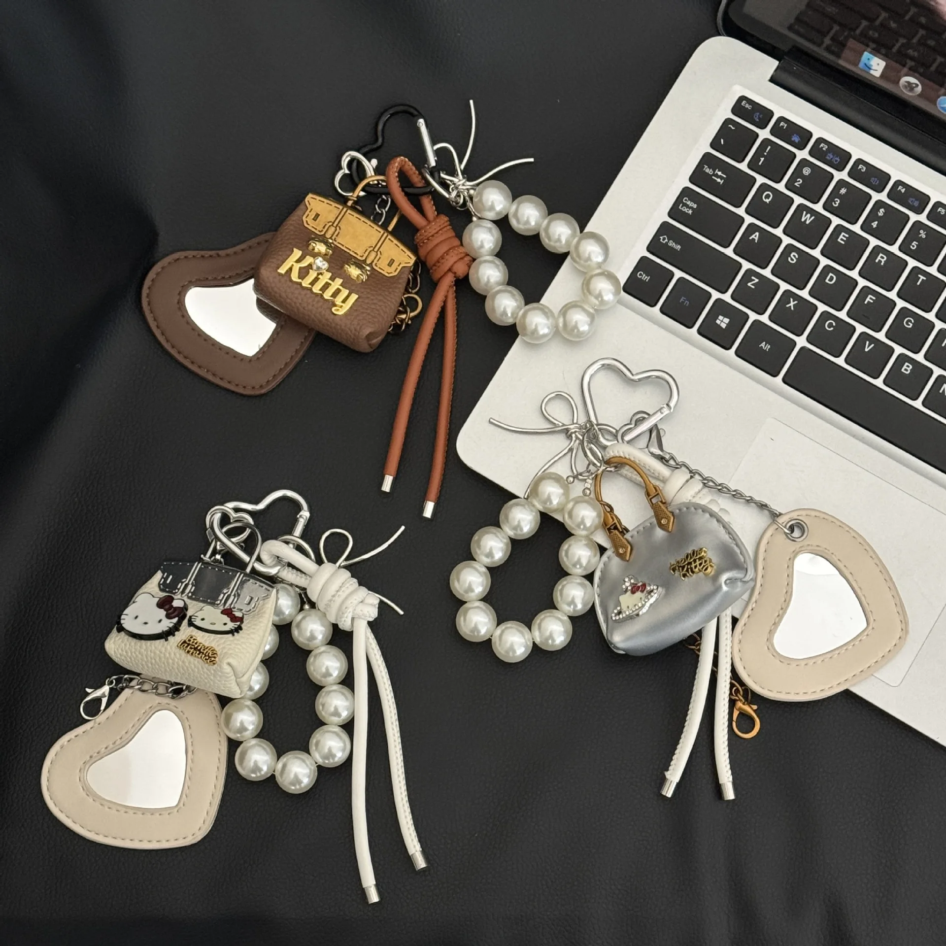 

1/8pcs Creative and adorable cat-shaped mini bag charms, backpack accessories, keychains, and decorative pearl chains