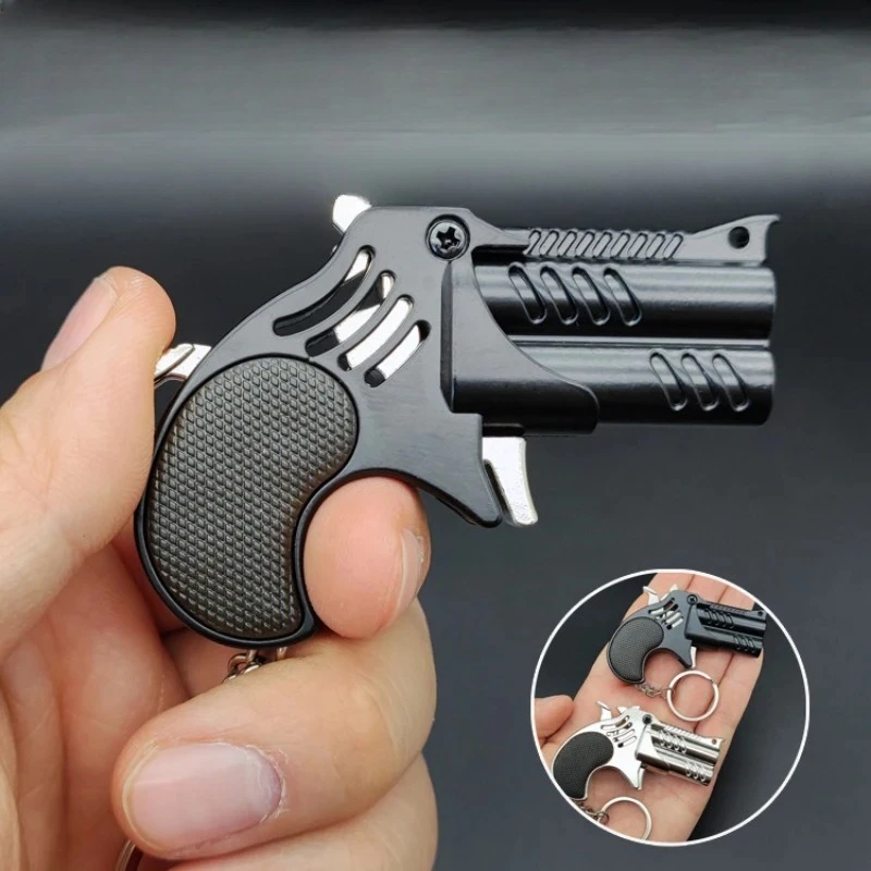 

1Pcs Mini Keychain Metal Rubber Band Gun Game Toy Gun Launcher Children's Simulation Pistol Toys Gifts Pendent