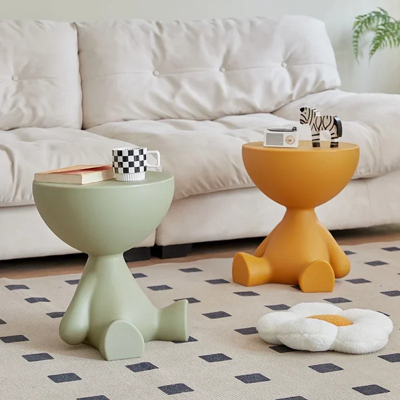 

Creative small flat head coffee table cream style living room simple lying flat edge few designer sofa next to home decoration.