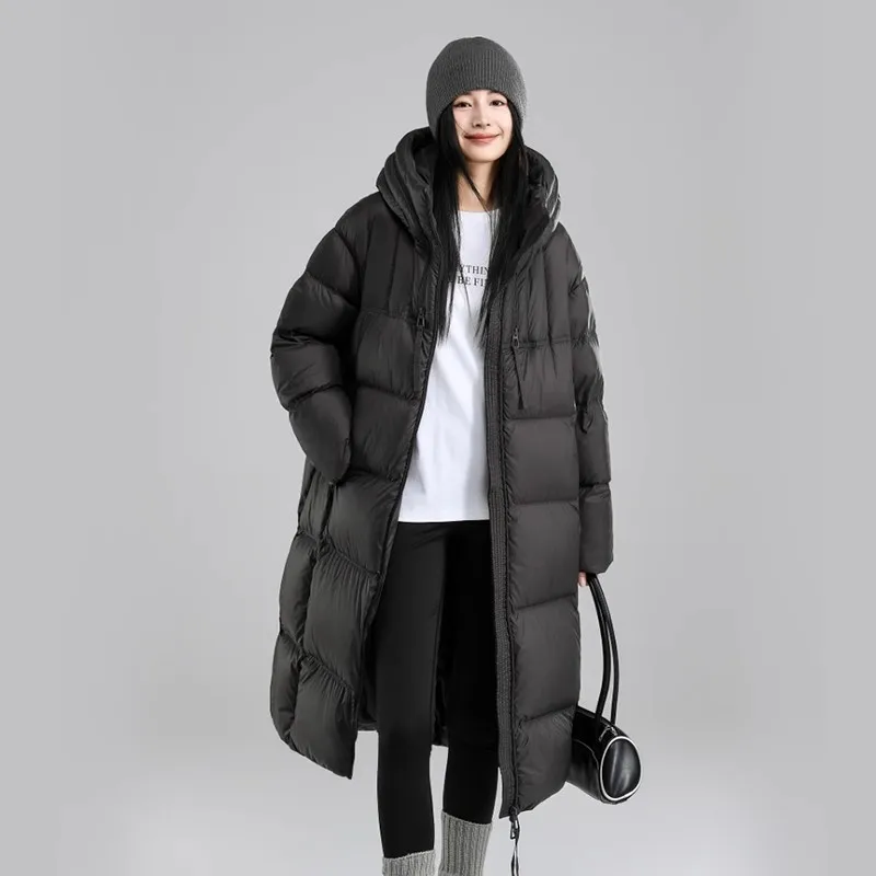 Piumino lungo a sbuffo per donna Inverno 2025 Nuovo cappotto con cappuccio addensato resistente al freddo allentato Cappotto Parka caldo con cappuccio femminile