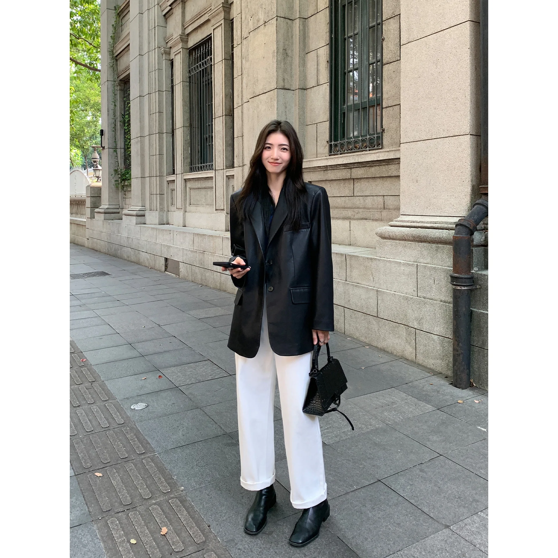 เสื้อแจ็คเก็ตหนัง PU สีดำสำหรับผู้หญิง ฤดูใบไม้ผลิ ฤดูใบไม้ร่วง รุ่นใหม่ ทรงหลวม สง่างาม ระดับไฮเอนด์ ขนาดเล็ก