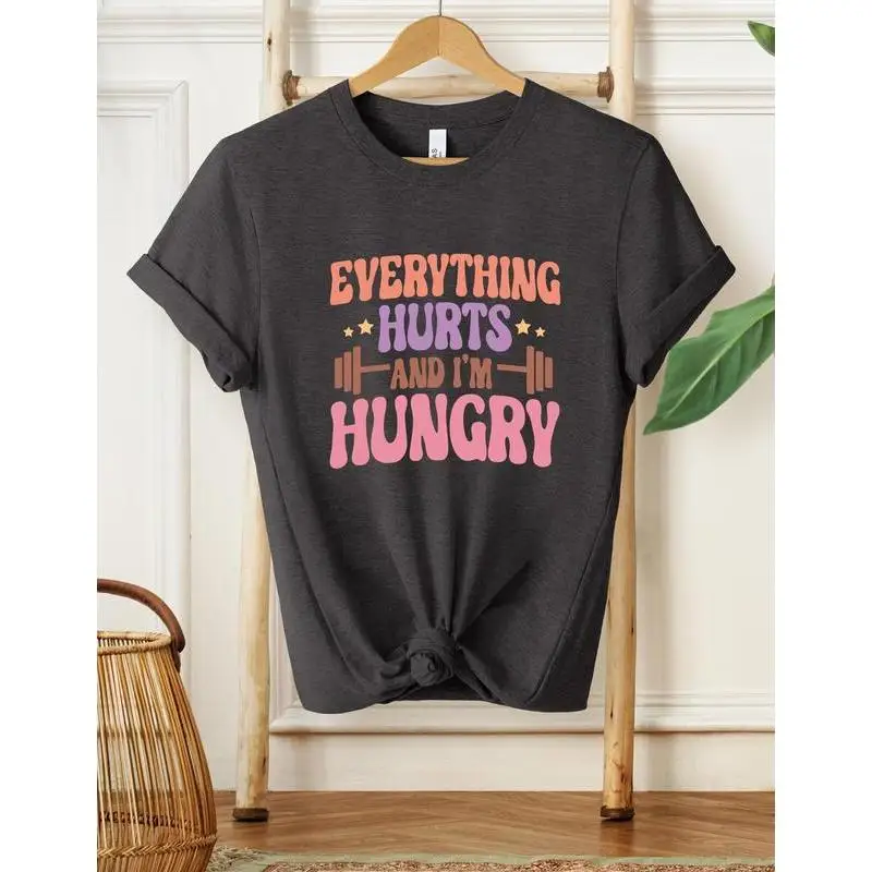 

Funny Workout T-Shirt Everything Hurts and I’m Hungry Graphic Tee Slim Fit Casual Top for Gym Lovers or Gift Idea S-3XL