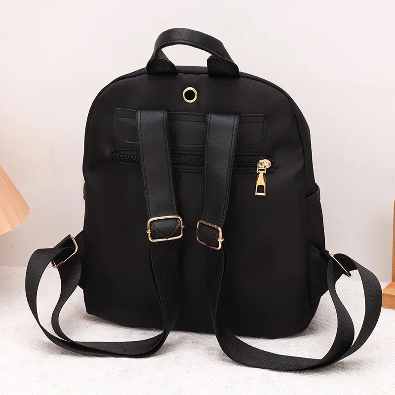 2024 Women\'s New Solid Color Zipper Waterproof Nylon Fashion Backpack Large Capacity Casual and Versatile Commuting Backpack