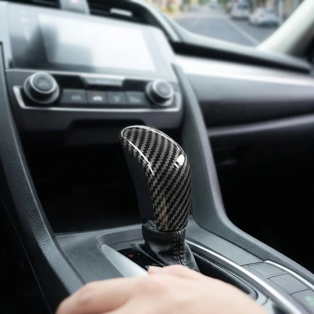 Elevate your For Nissan For Sentra\'s interior design with this premium Carbon Fiber Look Trim for the gear shift knob