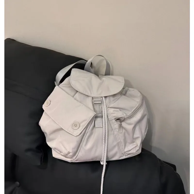 Fast Fashion Outdoor Leisure Large Capacity Korean Niche Design Pocket Button Drawstring Backpack Nylon Backpack Designer Bag
