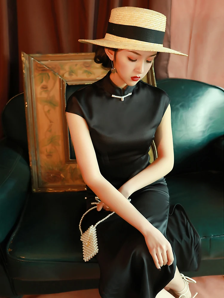 

Элегантное черное облегающее платье-бодикон в стиле ретро с низким вырезом и коротким рукавом, удлиненное, для повседневной носки, онлайн-продажа.