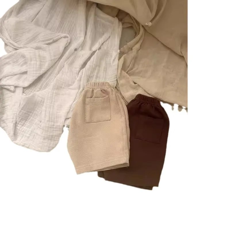 Vestiti del bambino tinta unita semplice tutto abbinato pantaloncini 2024 autunno nuovo stile coreano ragazzi e ragazze pantaloni Casual moda bambino