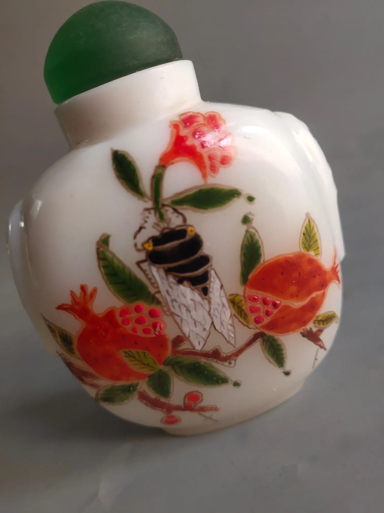 A selection of old Chinese colored glass bottles decorated with small ornaments