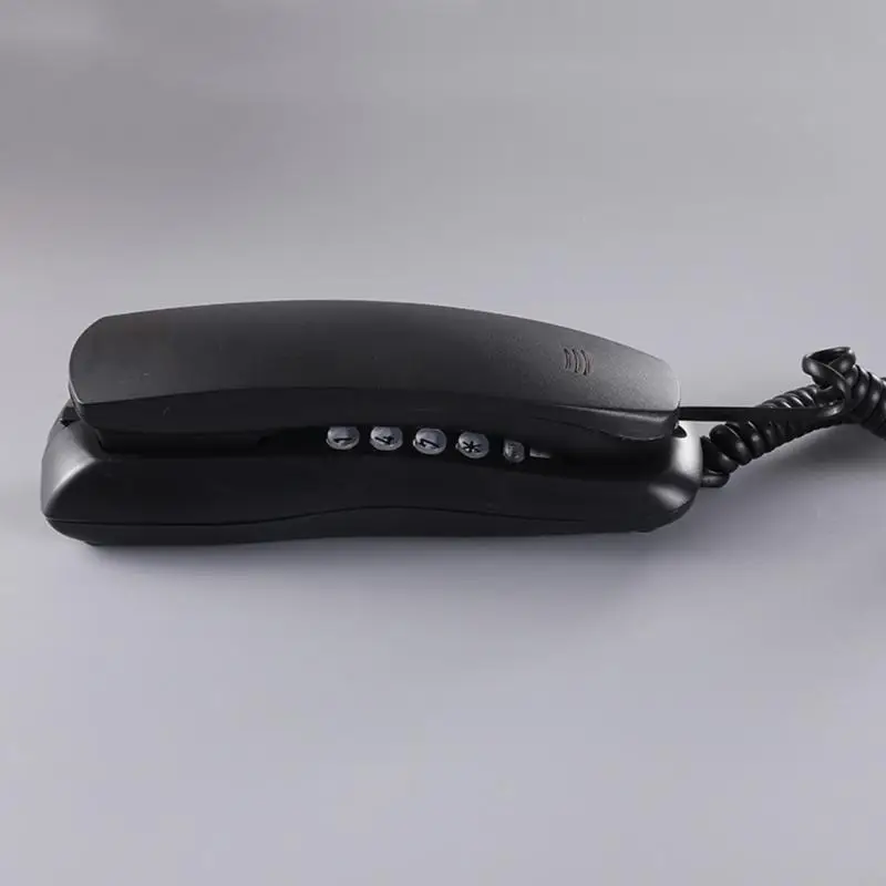 هاتف متصل بالهاتف المدمن على الهاتف المحط على الجدار.