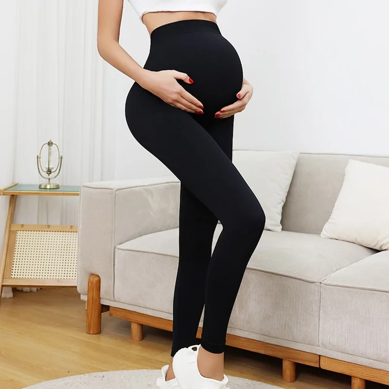 Nuovi pantaloni da yoga lavorati a maglia senza cuciture Leggings da gravidanza a vita alta Abiti premaman per donne incinte Pantaloni lunghi per il corpo di supporto della pancia