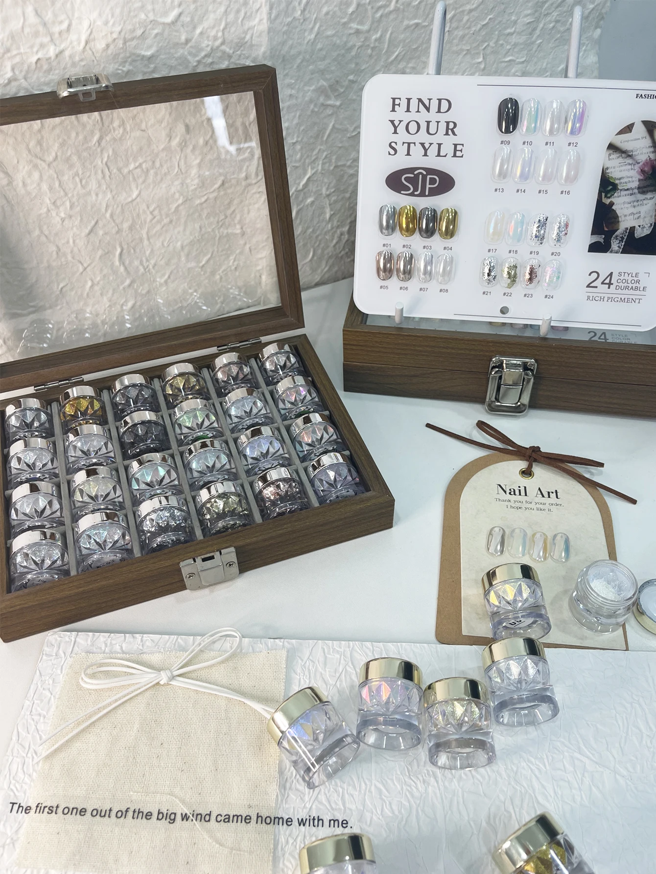 24-color nail polish magic mirror powder set with storage box, color cards, aurora nail polish powder, and gold foil powder.