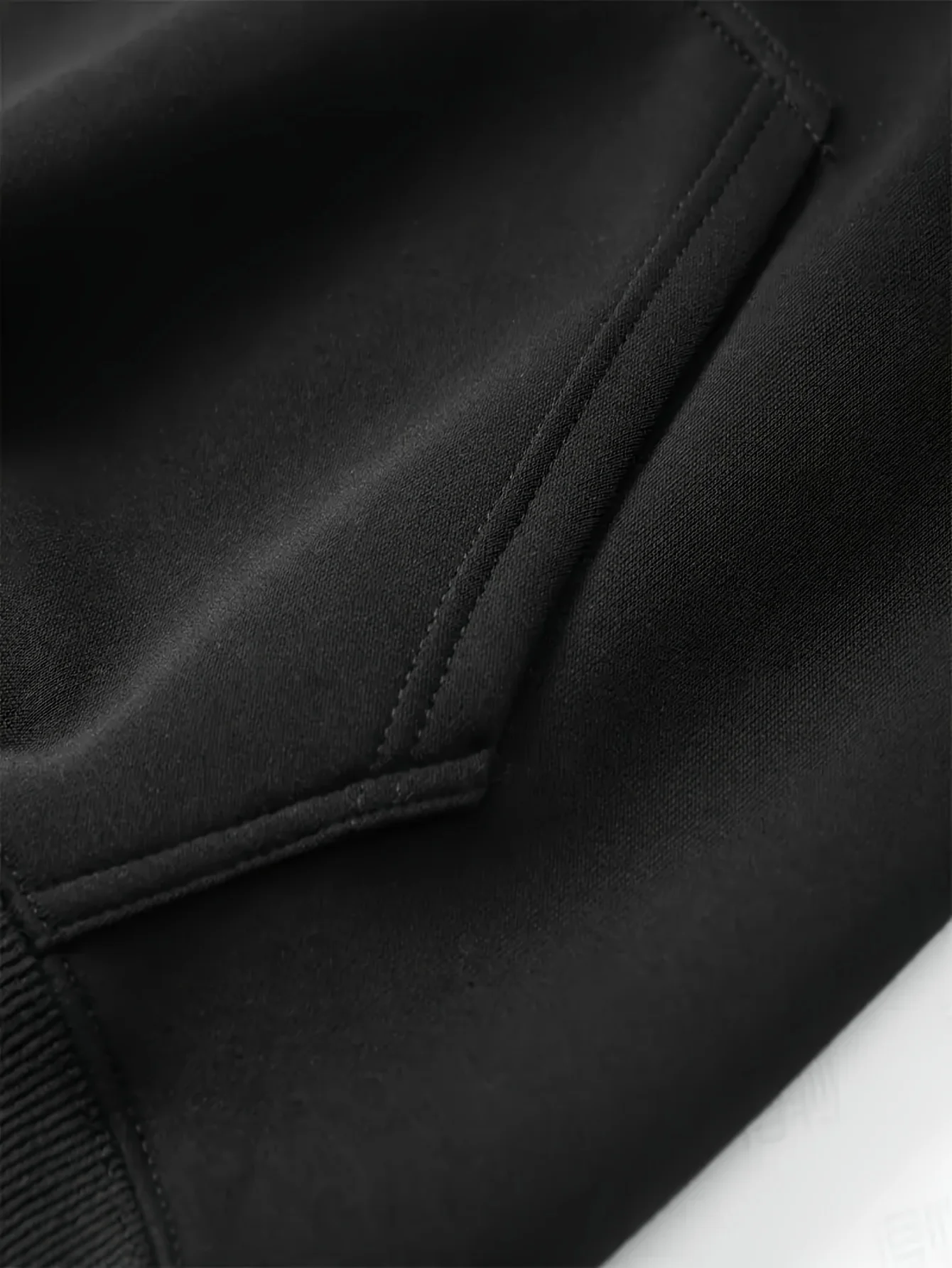 Classic Black Pullover Hoodie with Kangaroo Pocket, Made from A-Grade Material, Perfect for Game Day and Casual Wear for Both Men and Women This Urban Fashion Item Offers a Sense of Edgy Aesthetics and a Comfortable Fit, Making It Perfect for Fashion Enthusiasts. - view 3