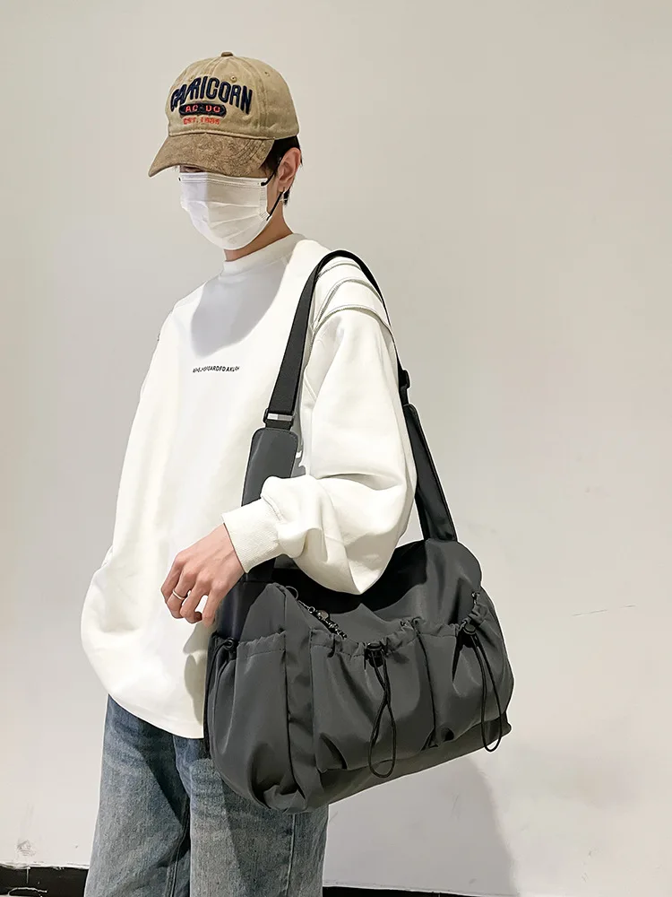 

2026New large-capacity canvas men's and women's fashion tote bag, simple and versatile shoulder and crossbody bag, tutoring bag