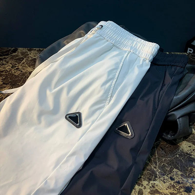 Pantalones deportivos informales ultrafinos de verano para hombre, pantalones ajustados de secado rápido, elásticos, ligeros y a la moda