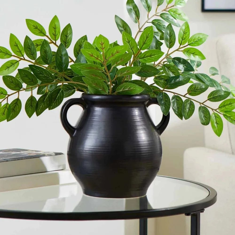 

Black ceramic vase with ribbed finish
