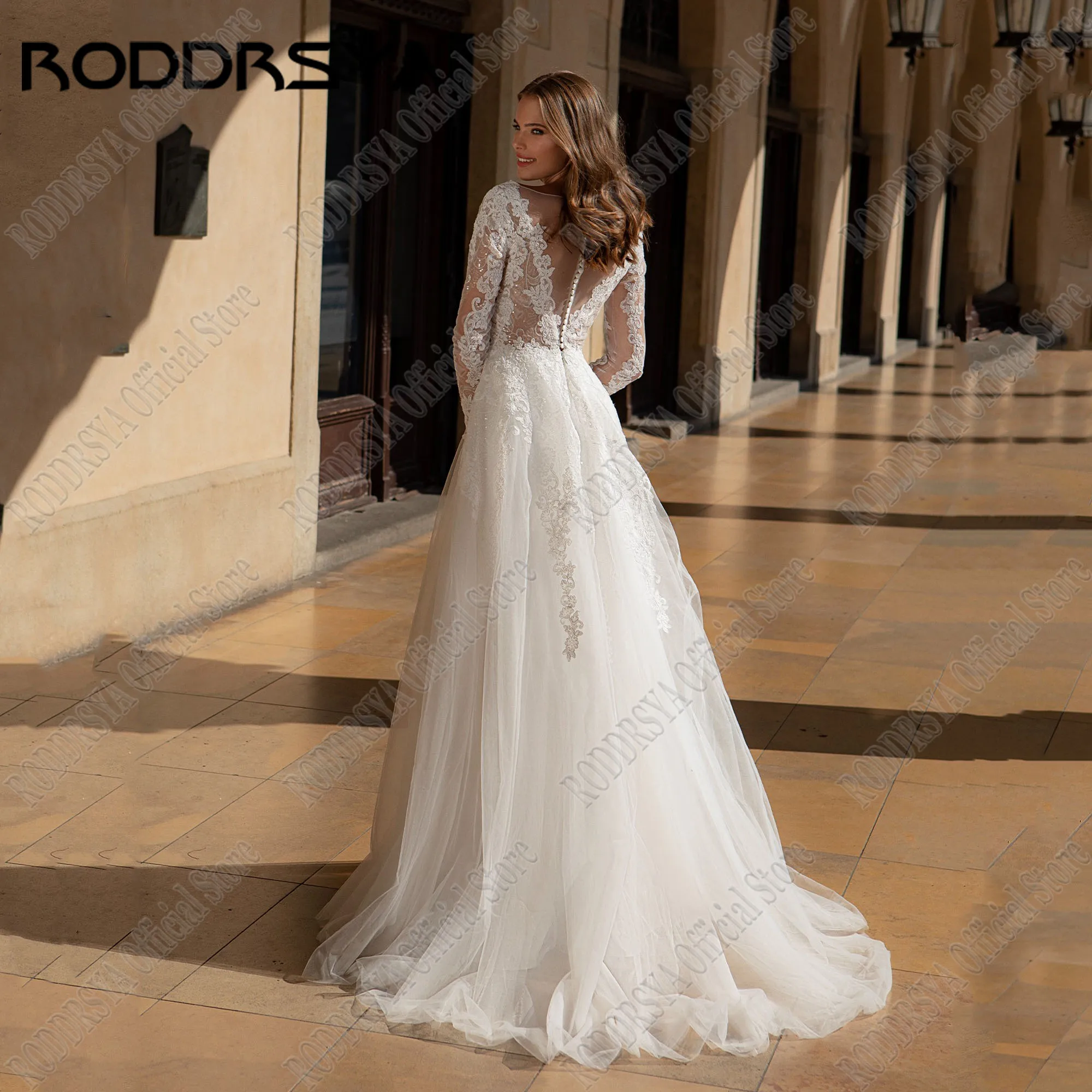 RODDRSYA فستان زفاف مخصص أنيق طويل الأكمام شفاف رقبة مطرز بالترتر Vestidos De Novia فستان العروس قطار الاجتياحفستان الزفاف الأنيق الأكمام الطويلة شفافة منخفضة العنق جولة الترتر زين صدرية دي نوفيا فستان الزفاف