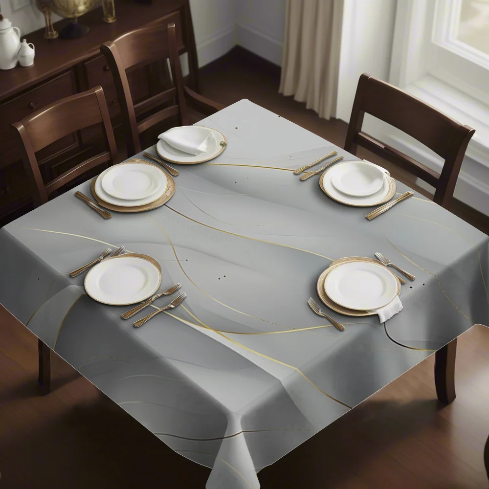 The new printed square tablecloth is an elegant square tablecloth. It has a light gray base with lively golden lines.