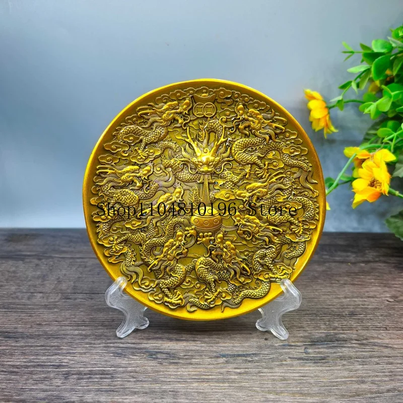 Antique bronze-colored disc depicting nine dragons playing with pearls, an alloy plate for home decor, a decorative ornament fea