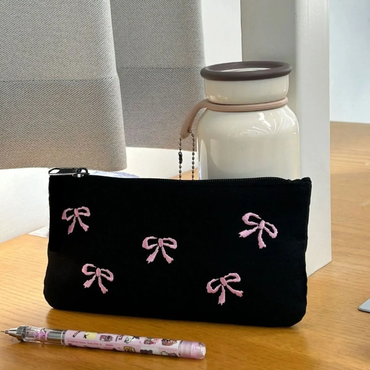 Black bow embroidery pen bag High appearance level Cosmetic storage bag Simple ins cosmetic bag 1 pack (zipper direction random)