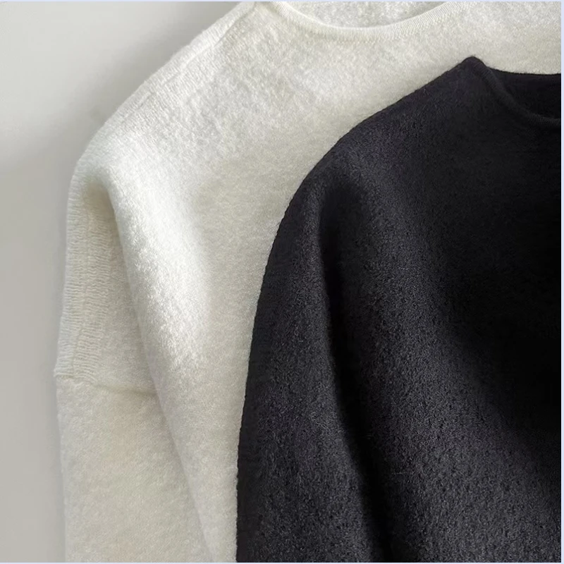 24 year autumn/winter wool texture loose version with double-sided slits at the hem and wide sleeves, shoulder down sweater