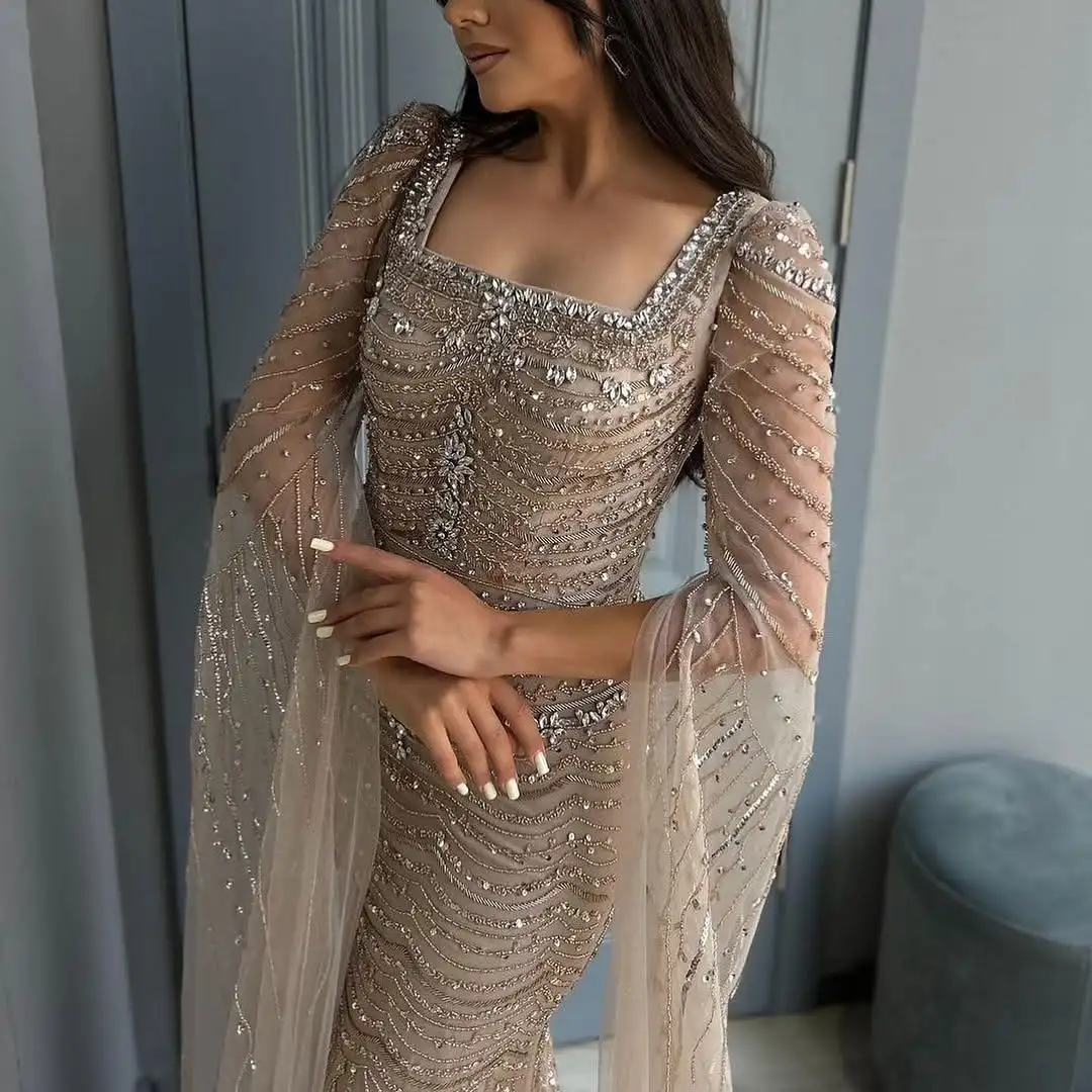 ROSEINTHEBOX Abito da sera a sirena con perline personalizzato Arabia Saudita 2025 Maniche a mantella Dubai Abito da ballo di lusso per occasioni formali
