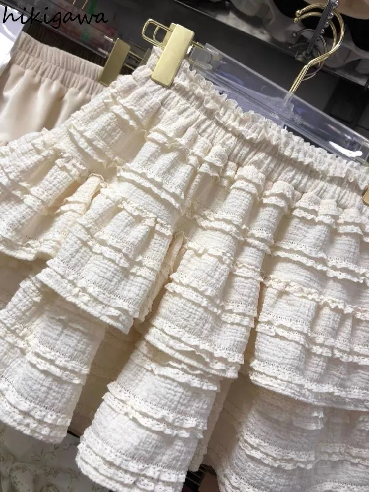 Falda acampanada De cintura alta para Mujer, minifalda japonesa con pliegues De encaje, color blanco, a la Moda, verano, 2024