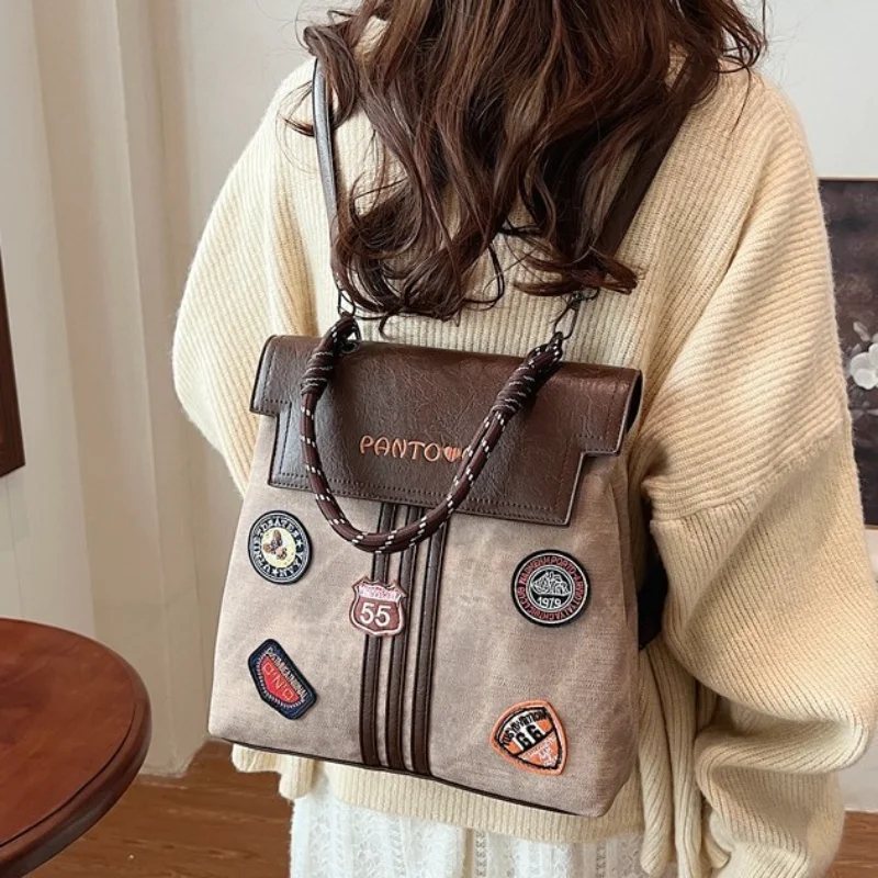 

​2025 Preppy Badge Backpack - Large Capacity Convertible Shoulder Bag Ergonomic Water-Resistant Commuter Vintage Tote for Women​