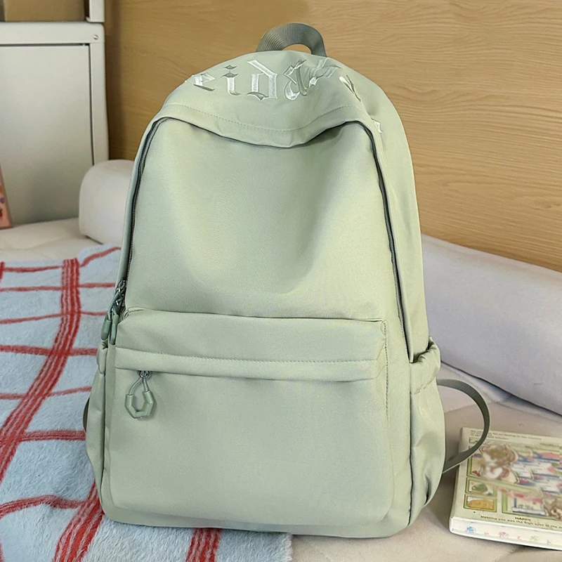 Mochila simple de color sólido con decoración de lazo, mochila informal con múltiples bolsillos de gran capacidad, adecuada para uso diario y estudiantil