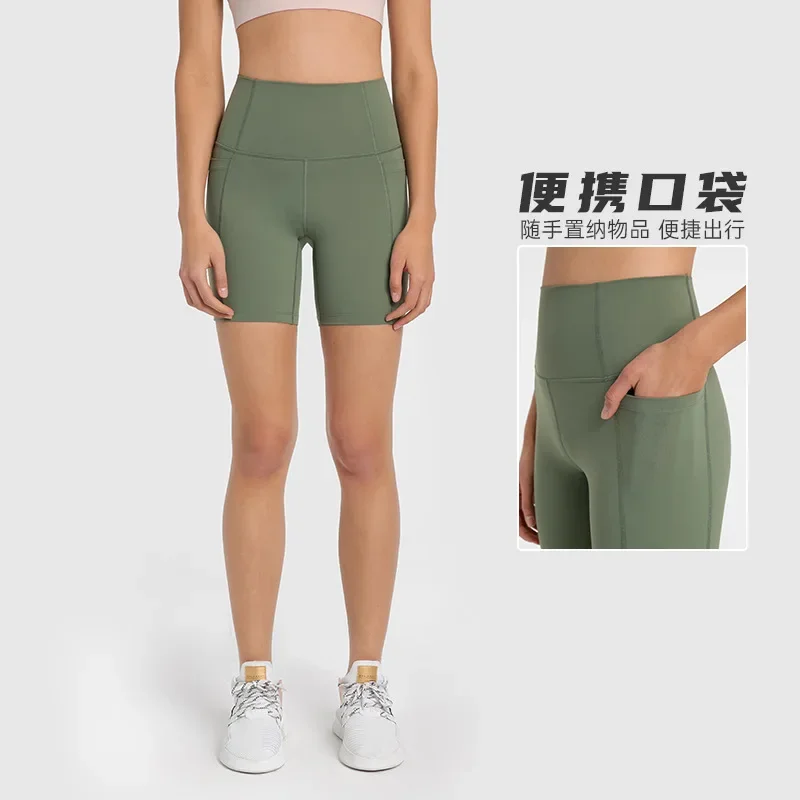 

New spliced side pocket sports quarter length pants for women, high waist and hip lifting, tight fitting fitness yoga shorts