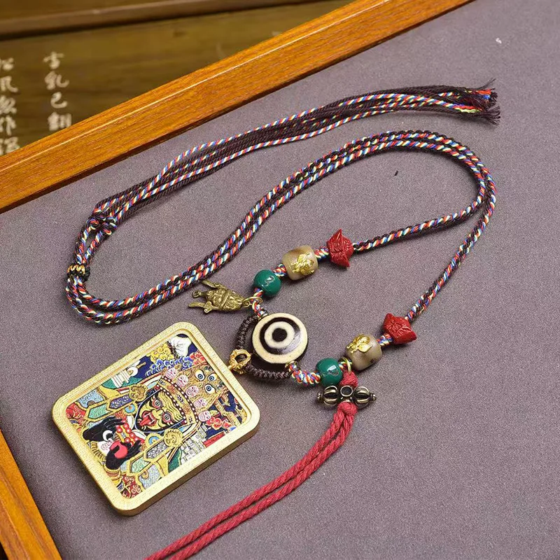

Hand-woven adjustable Tibetan-style necklace with Zaki Ram thangka pendant, sheep's eye bead, and Tibetan prayer beads