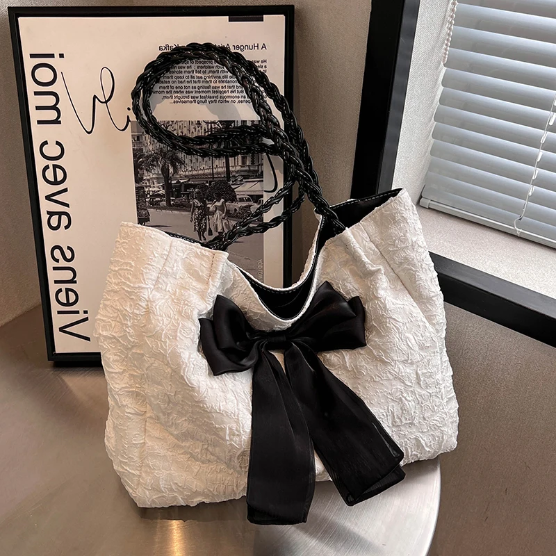 Легкая роскошная универсальная холщовая сумка большой вместимости на одно плечо, новинка 2025, модная сумка-тоут с бантом подмышками, женская пригородная сумка на плечо