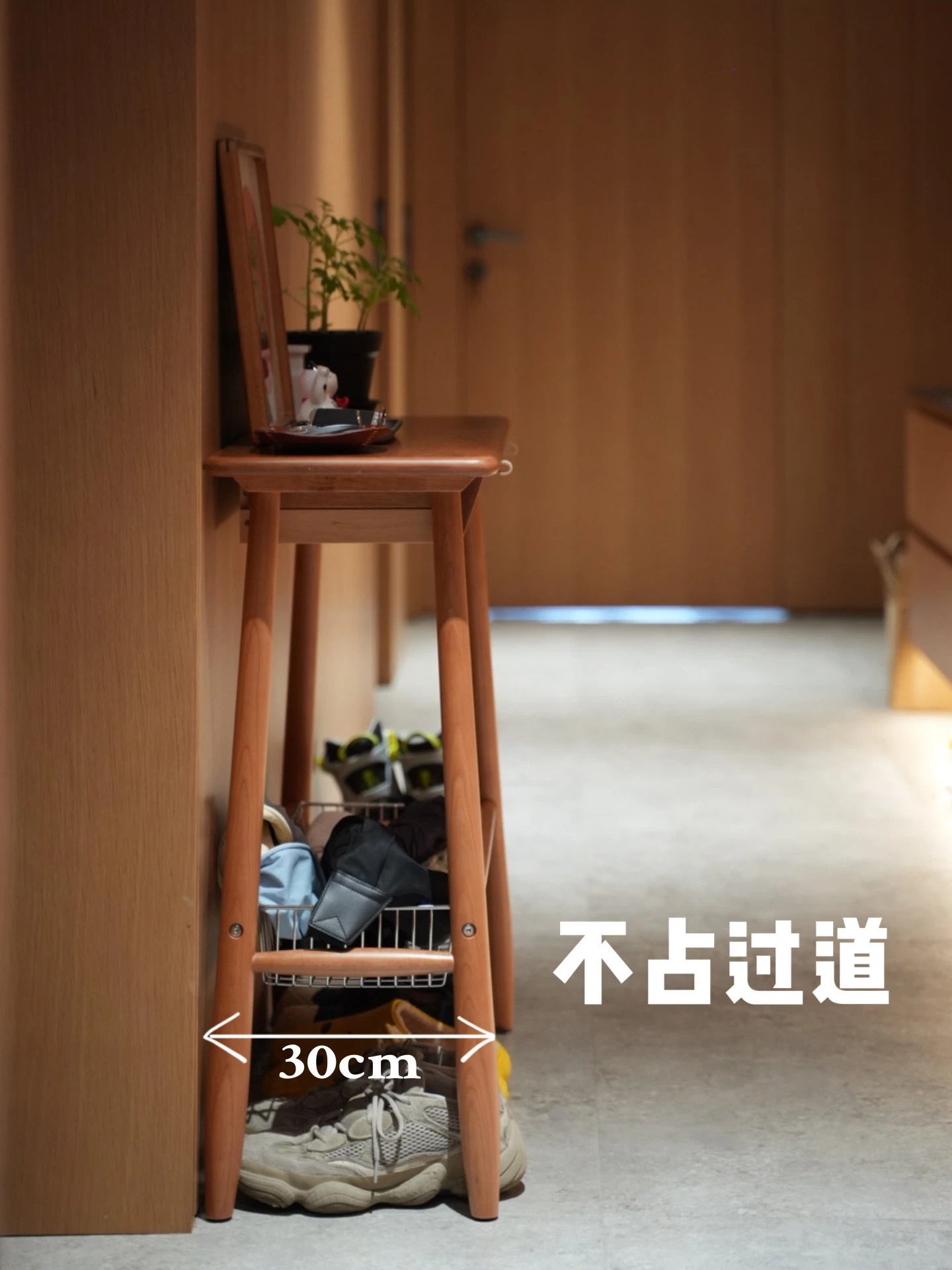 The second generation of small objects has a very narrow space in  corridor by  sofa in entrance