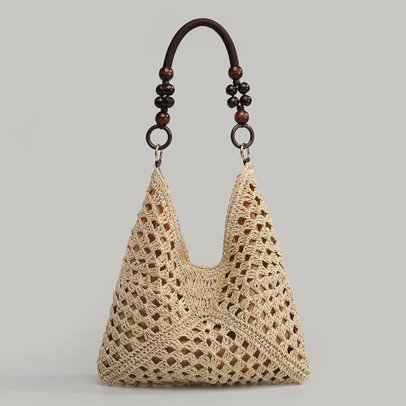 

New summer women's French hollow straw woven underarm tote bag 2026 stylish holiday style beach shoulder bag barrel casual bag