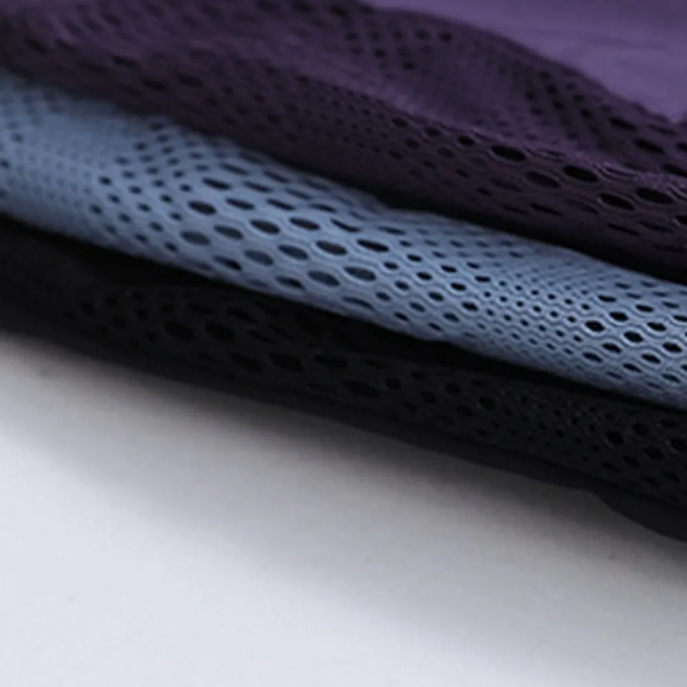 Pantaloncini sportivi da corsa Pantaloncini da yoga con design a rete Tasche laterali Orlo Pantaloncini sportivi elastici Pantaloncini fitness larghi e traspiranti Yoga